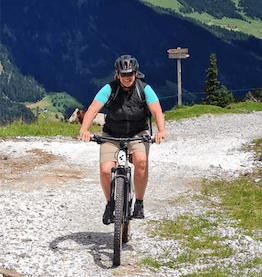 woman on mountainbike in mountains bike leasing