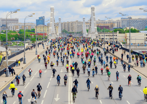 Many cyclists on bridge