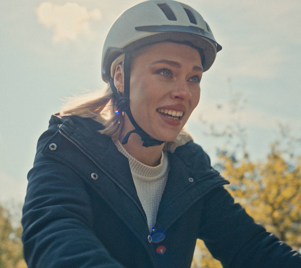 woman with helmet smiling