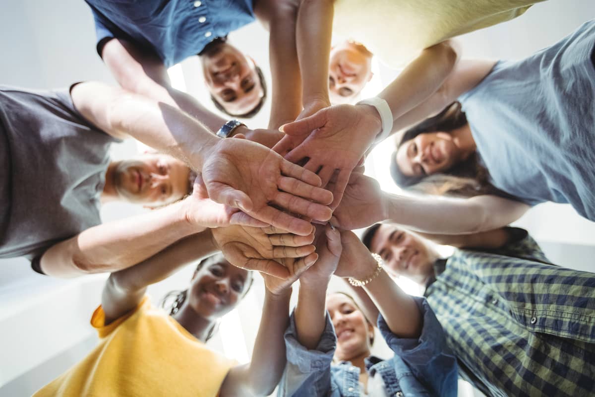 Group of people with their hands together